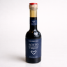 Bottle of Aceto Balsamico on a white background