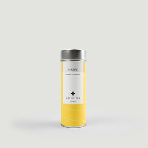 Yellow tea canister with silver lid on a light gray background