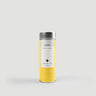 Yellow tea canister with silver lid on a light gray background