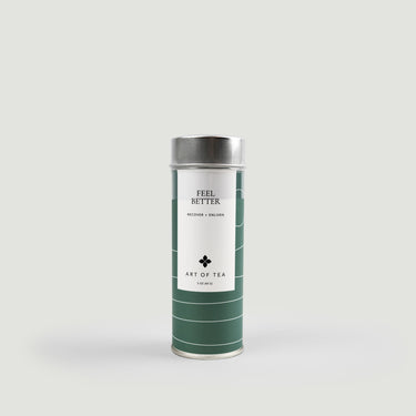 Tea canister with 'Feel Better' text on a light gray background