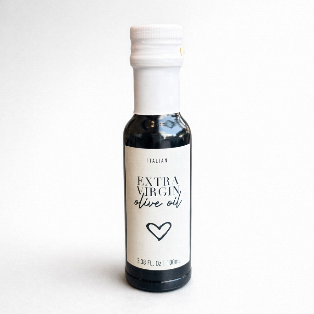 Bottle of Italian Extra Virgin olive oil with a white label on a white background