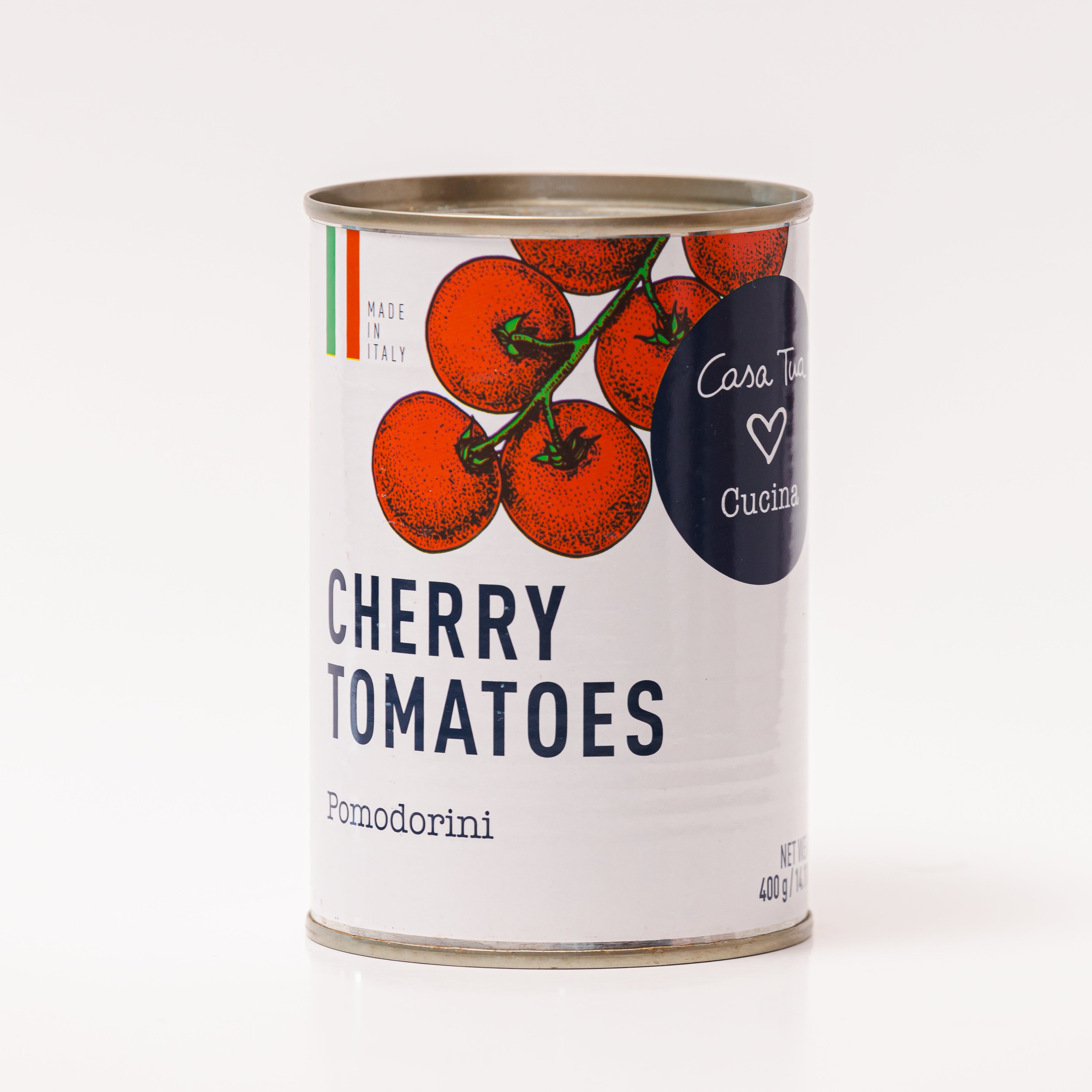 A can of Casa Tua Cucina cherry tomatoes, with an illustration of tomatoes on the label and the text 'Cherry Tomatoes' in bold. The can is labeled with 'Pomodoro' which is a type of tomato, and 'Casa Tua Cucina' which means 'Your Kitchen' in Italian.