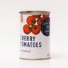 A can of Casa Tua Cucina cherry tomatoes, with an illustration of tomatoes on the label and the text 'Cherry Tomatoes' in bold. The can is labeled with 'Pomodoro' which is a type of tomato, and 'Casa Tua Cucina' which means 'Your Kitchen' in Italian.