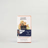 A packaged milk chocolate bar with hazelnuts, branded 'TOSCANO NOCCIOLA' by AMDEI, displayed against a white background.