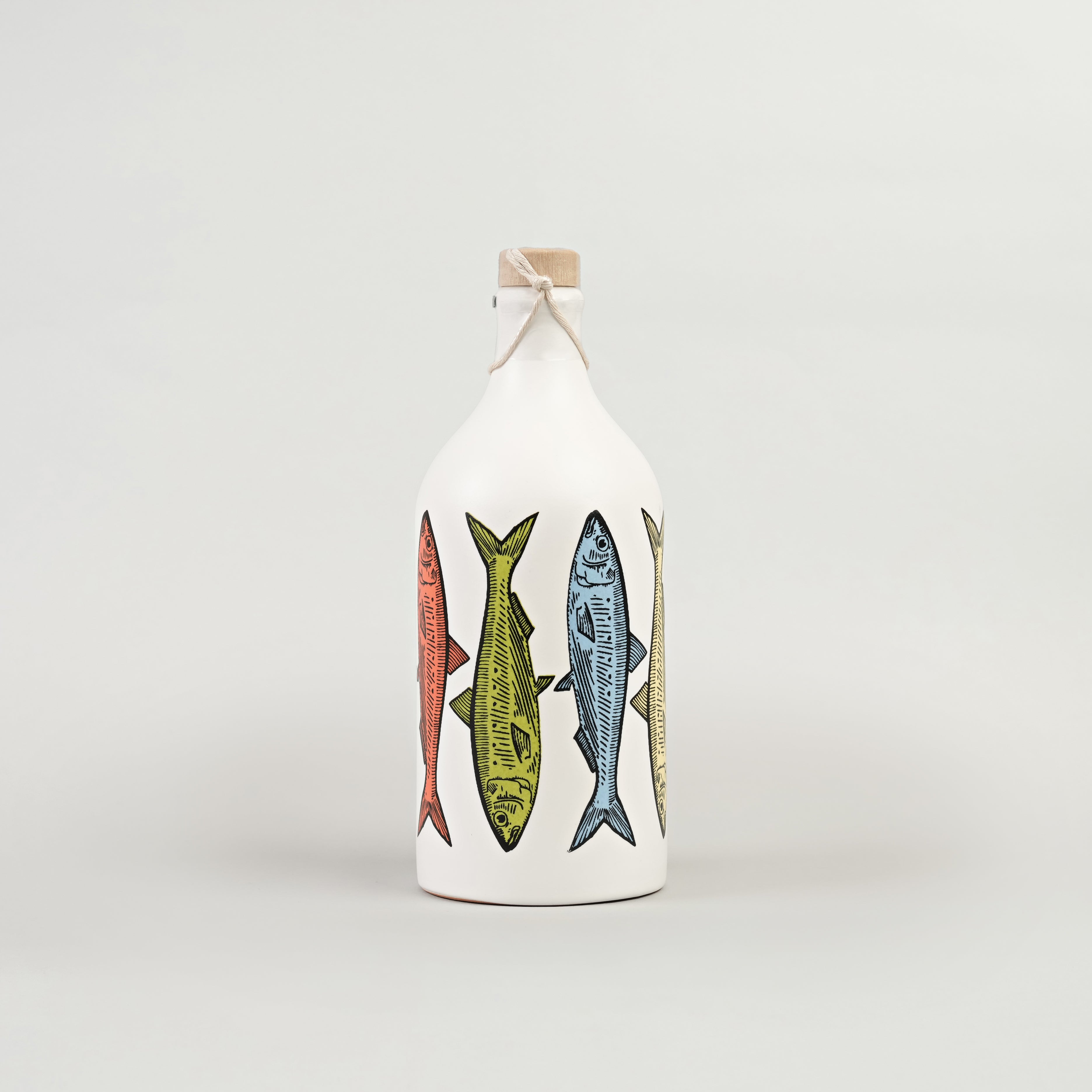 A white oil dispenser bottle with a label featuring colorful illustrations of sardines.