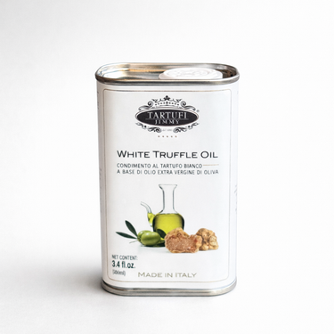 Tin of Tartufi Emme white truffle oil on a white background