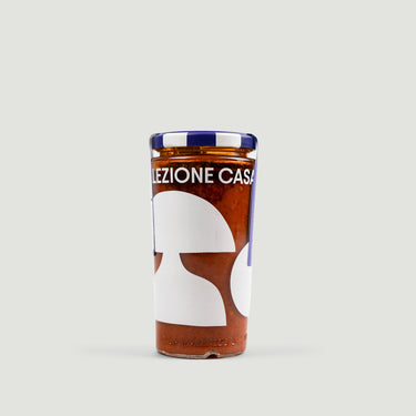 Bottle with a label reading 'Selezione Casa' on a light gray background