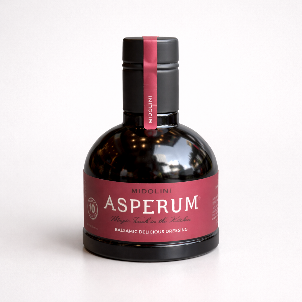 Bottle of Asperum balsamic dressing with a red label on a white background
