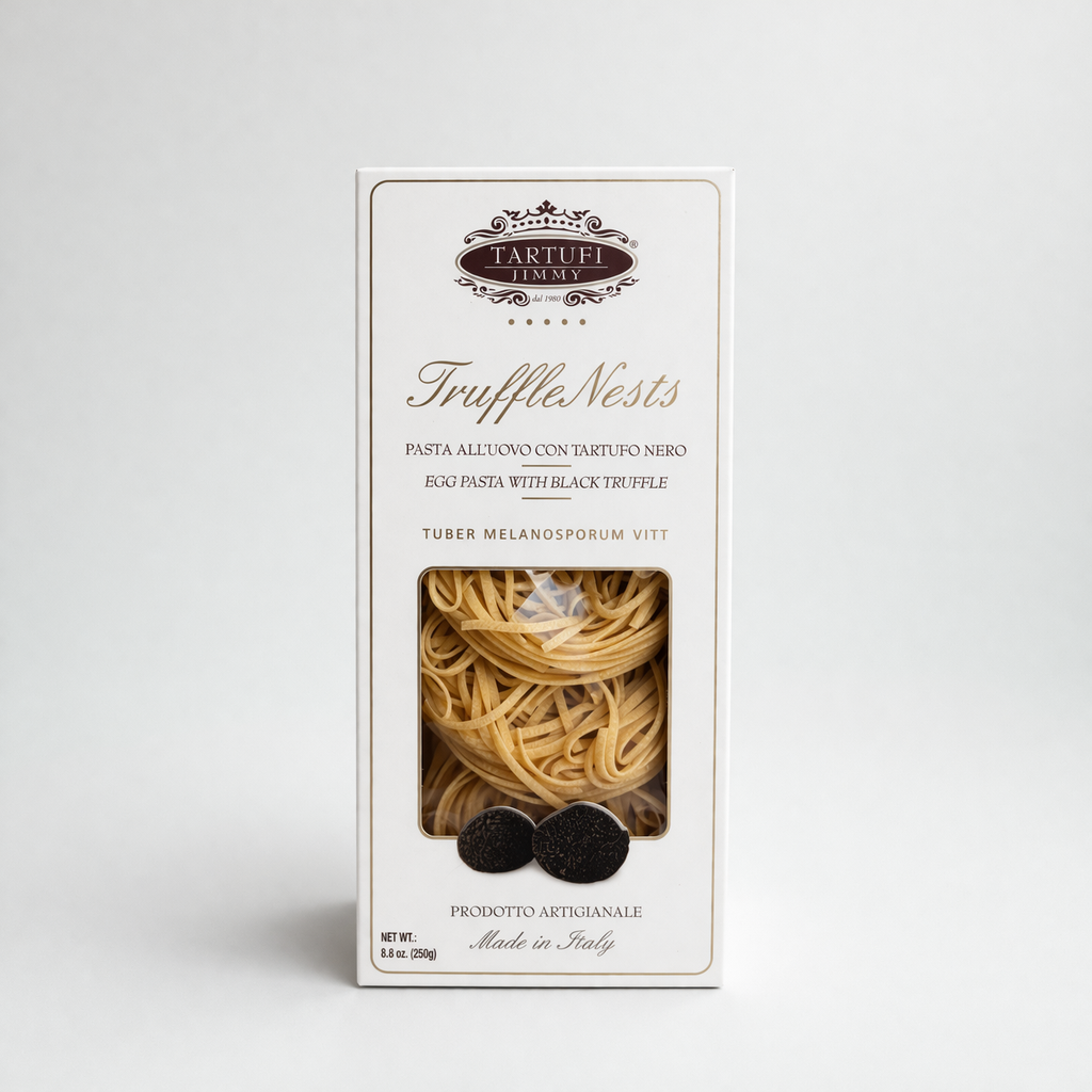 Box of TruffleNests pasta with black truffles on a white background